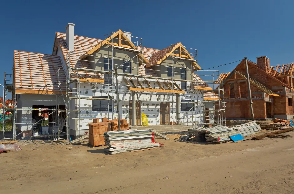 A house is being built in a residential area.